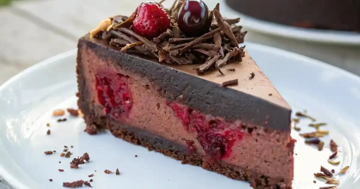 Delicious Black Forest Cheesecake with chocolate layers and cherry topping