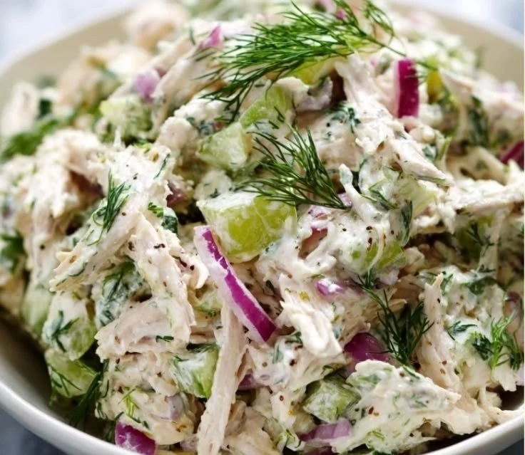 Healthy chicken salad with fresh vegetables and a light dressing