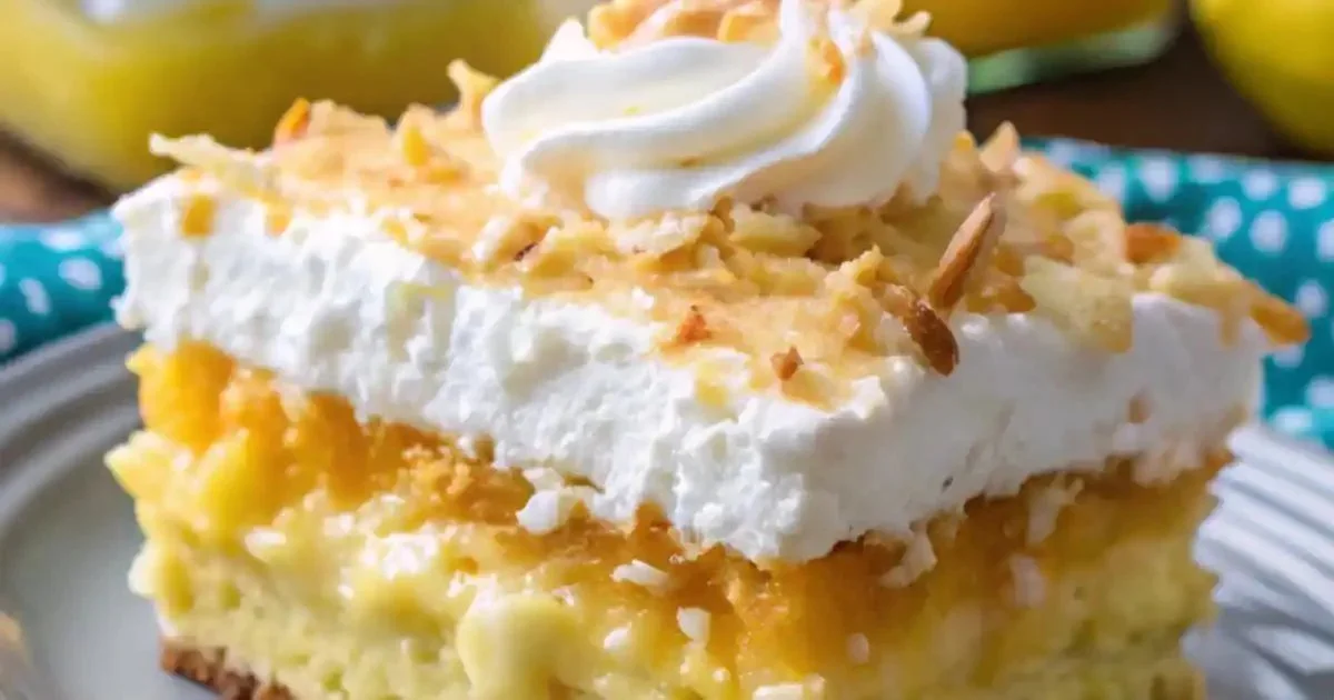 Delicious Pineapple Coconut Dream Cake topped with pineapple and coconut flakes