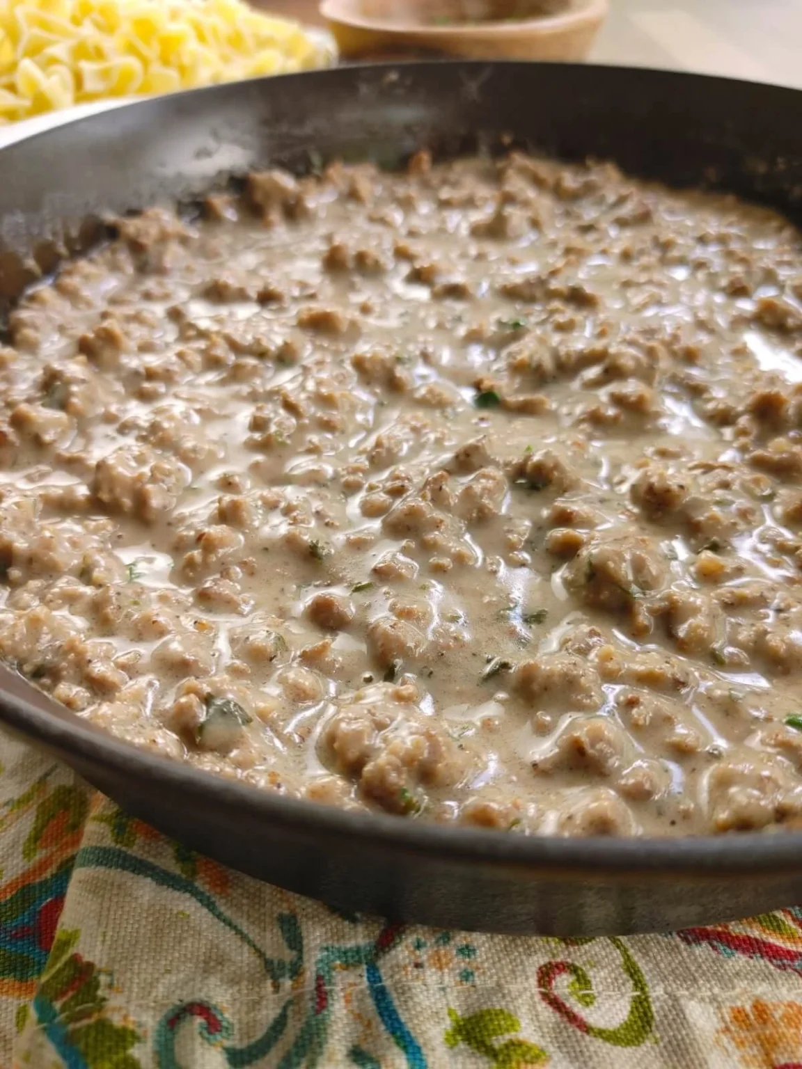 Delicious homestyle hamburger gravy served over mashed potatoes